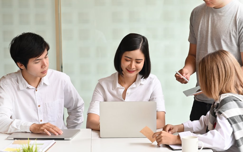 Young team of business meeting with laptop in office workplace.