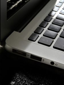 Free Detailed view of a silver laptop showing keyboard and multiple ports. Stock Photo