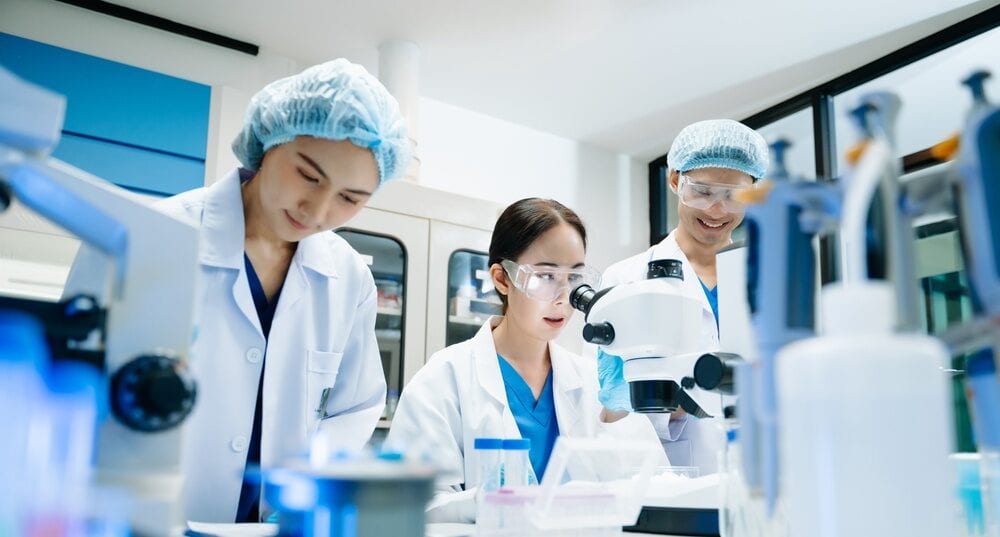 Scientists analysing samples in a life sciences laboratory